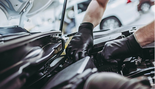 person fixing car