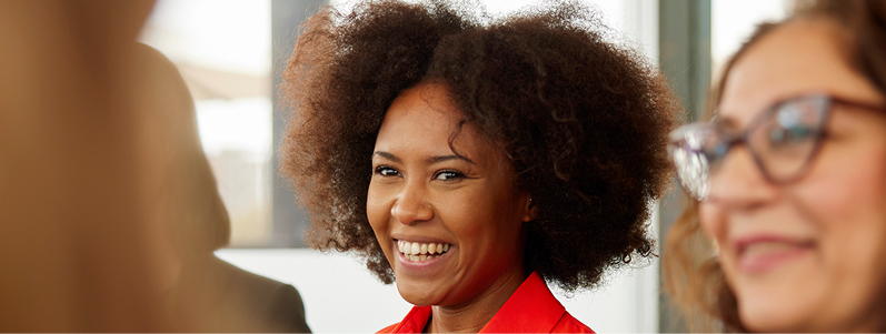 close-up of business person in an orange shirt