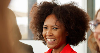 xclose-up of business person in an orange shirt