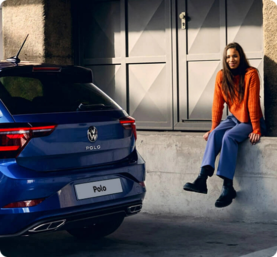 person sitting outside of car