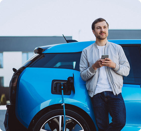 person leaning on a blue charging car