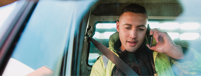 close-up image of person sat in car ,on the phone