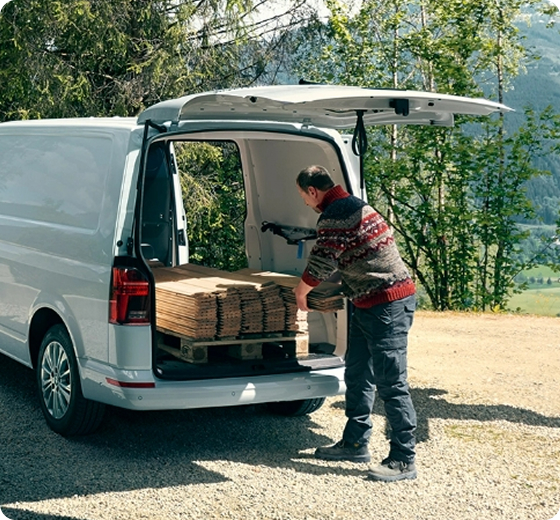person delivering boxes using van